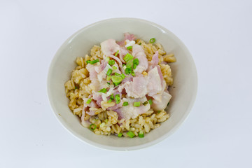 garlic fried rice with ham sliced and vegetable on top