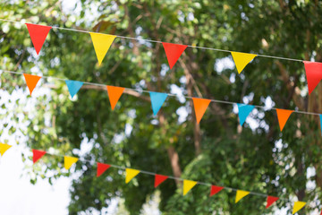 colorful triangular flags of decorated celebrate outdoor party
