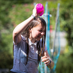 Teenage Girl Cools Down By Throwing Water Over Her Head