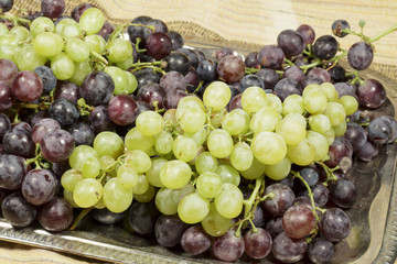 Tray with different types of table grapes freshly harvested