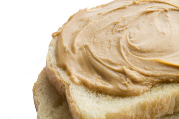 Peanut butter sandwich half cut isolated with white background.