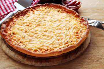 Tasty cheese pizza on table close up