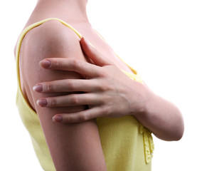 Young woman with shoulder pain isolated on white