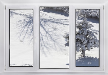 Modern plastic window with a winter landscape