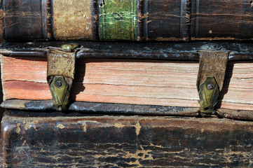 Pile of antique books with clasps 