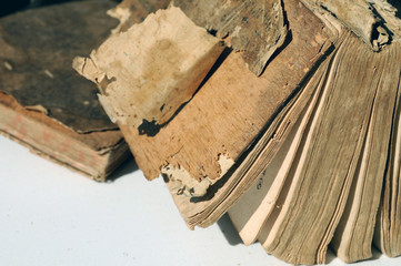 Ragged antique books with wooden covers