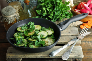 Sliced zucchini in pan on table, closeup