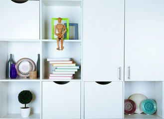 Beautiful white shelves with different home objects