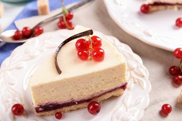 Tasty cheesecake with berries on table close up