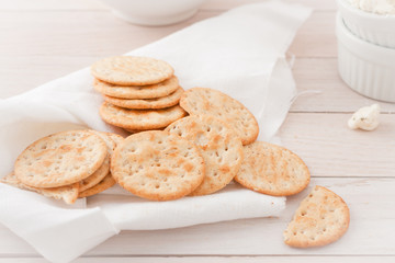 Fototapeta na wymiar round crackers on white linen napkin