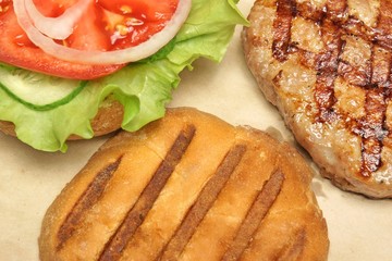 Close-up Top View Of Grilled Hamburger On Brown Paper