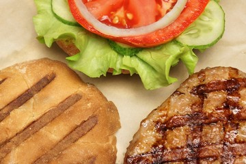 Close-up Top View Of Grilled Hamburger On Brown Paper