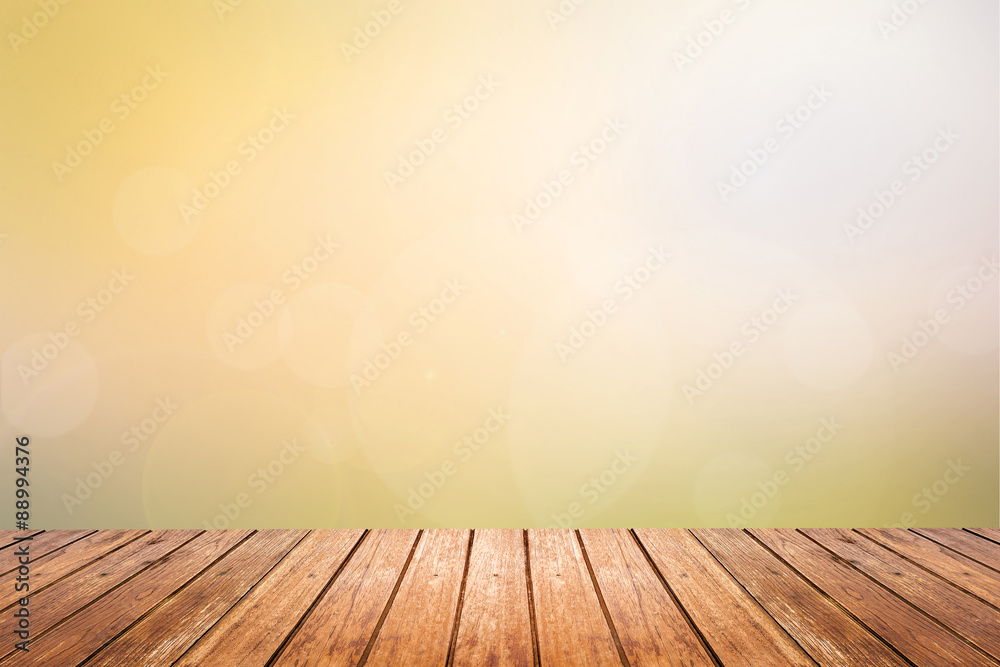 Wall mural wooden floor with sunset sky blurred background