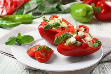 Fresh green salad in pepper on table close up