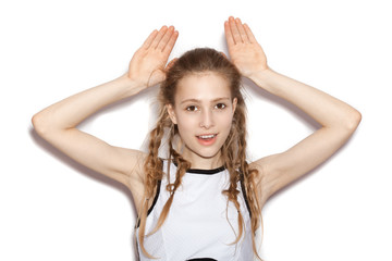 Fototapeta premium Girl showing bunny ears with her hands