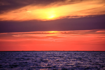 Amazing Sunset over an ocean with clouds