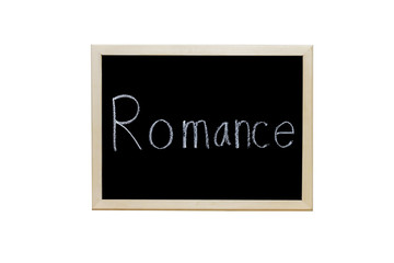 Romance written with white chalk on blackboard.