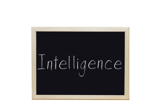 Intelligence written with white chalk on blackboard.