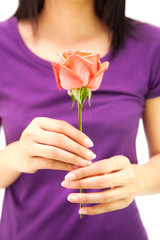 Girl giving pink rose flower