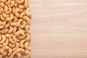 Cashew nuts on wooden background