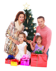 Obraz na płótnie Canvas Family at the Christmas tree