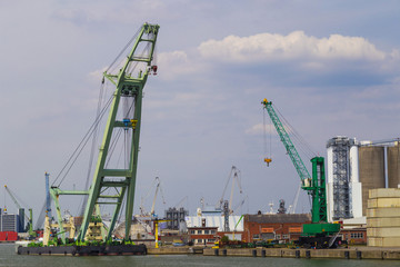 Fototapeta na wymiar Large container cranes in Port of Antwerp, Belgium