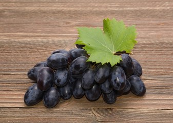 Grapes on wooden background