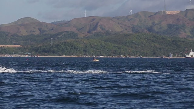 People riding jet ski on blue sea