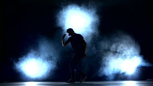 One hip hop break-dancer stylish man in sunglasses dancing