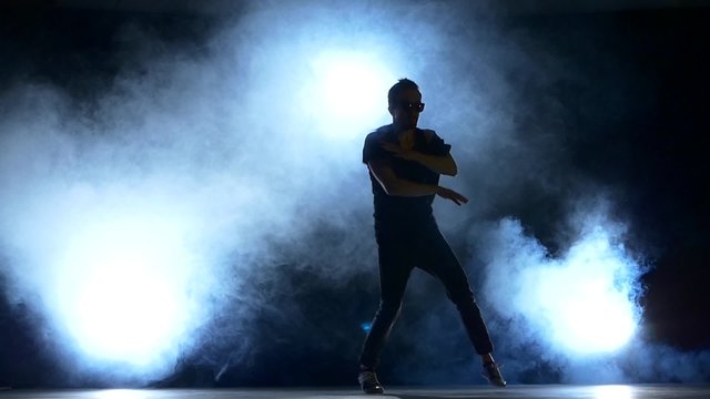 One hip hop break-dancer stylish man starts dancing, smoke
