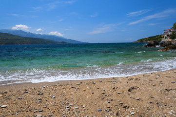Cobalt blue Aegean sea, mountains and rocks on the island of Samos, Greece