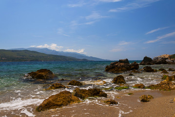 Cobalt blue Aegean sea, mountains and rocks on the island of Samos, Greece