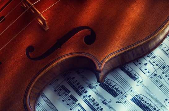 old and rare violin on a note sheet