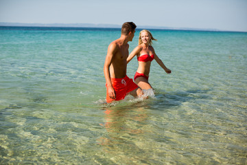 Young couple relaxing on the beach