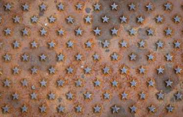 Five pointed stars on textured rusty metal background