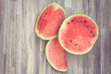 Watermelon on wooden background. Haze image