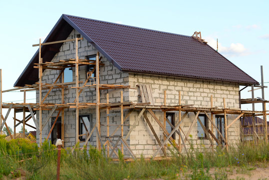 house under construction against the blue sky