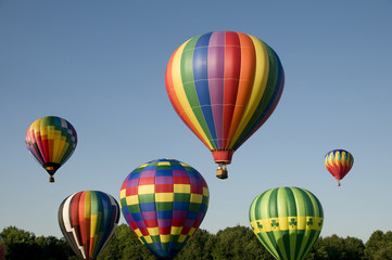 Fototapeta premium Hot-air balloons ascending or launching at a ballooning festival
