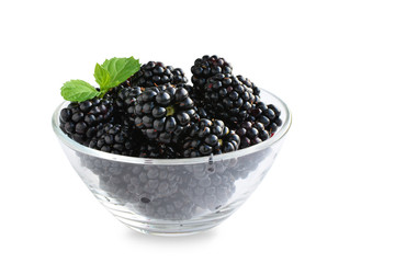 Fresh ripe blackberry fruits in glass bowl isolated