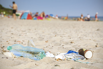 Fototapeta na wymiar Garbage on beach left by tourist, tourism impact on environmental pollution concept.