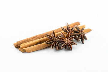 Star anise and cinnamon on white background