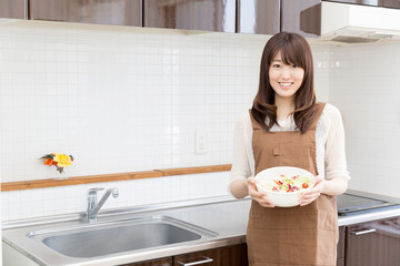 young asian woman kitchen image