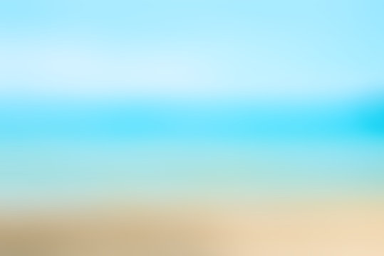 Blurred nature background. Sandy beach backdrop with turquoise water and bright sun light. Summer, Holidays, Vacation, Travel concept..
