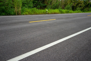 Fototapeta na wymiar Road asphalt texture with separation lines