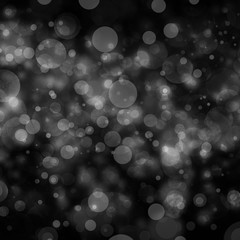 black background with white blurred bokeh lights