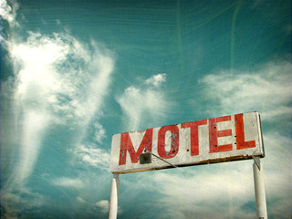 aged and worn photo of vintage motel sign