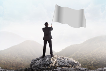 Successful man waving blank flag