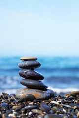 Stack of round smooth stones on the seashore