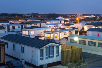 Mobile homes on a trailer park at dusk