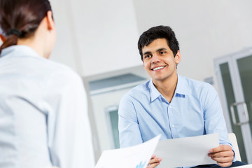 Two young people working as partners